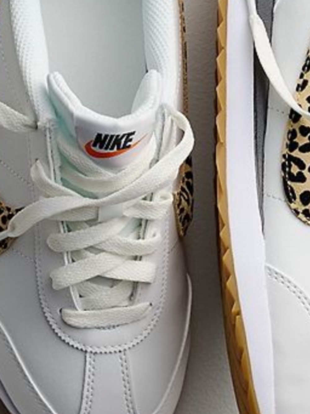 Nike Women’s White Sneakers with Leopard Swoosh